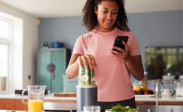 Girl in kitchen using her phone